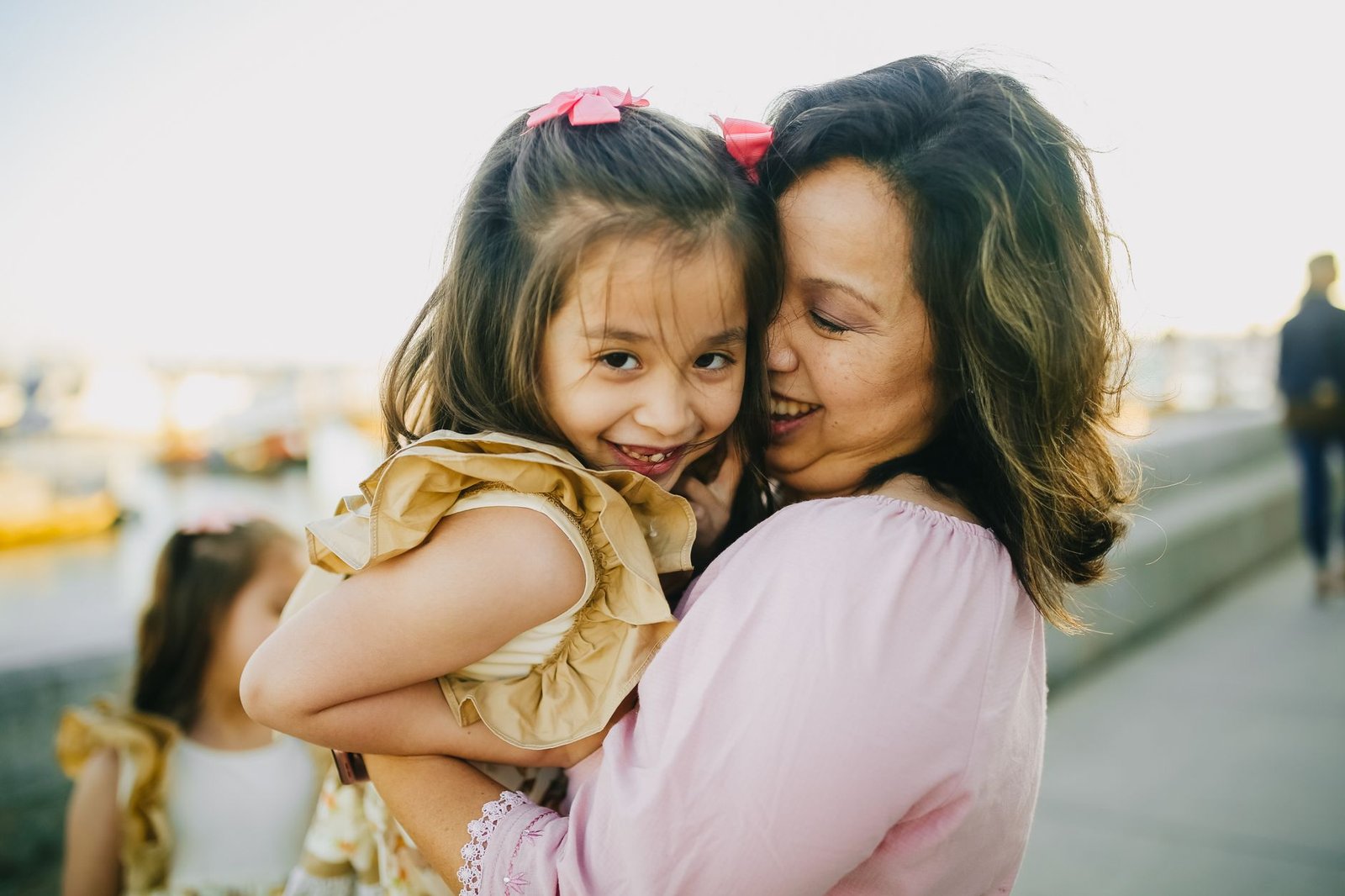 mother daughter laughing outdoor event